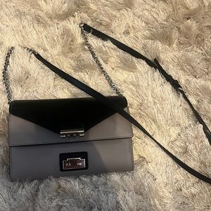 MICHAEL KORS crossbody or clutch designer bag.